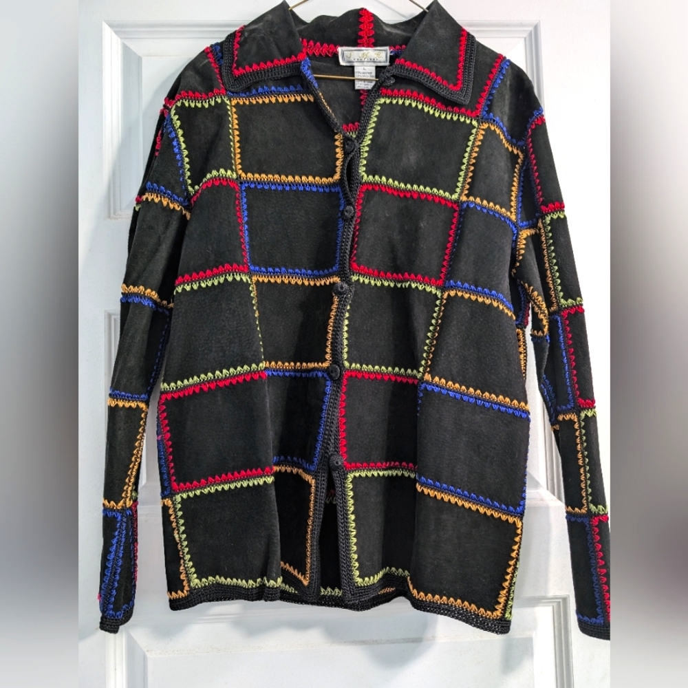 Black suede jacket with colored stitching.
